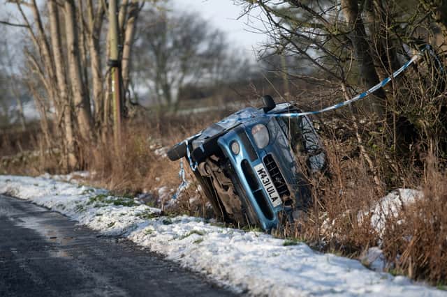 An overturned car by the side of the road on Beeley Moor above Chesterfield.