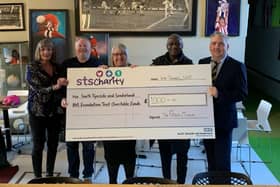 Maureen Summerill, Michael Ganley of the Fans Museum, Emma Scott, Directorate Manager Urology, Gary Bennett and Stuart McCracken, Clinical Director for Urology, with the cheque presented to the trust's charity.
