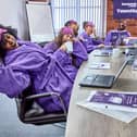 A group of Bensons workers come together to celebrate the humble yawn