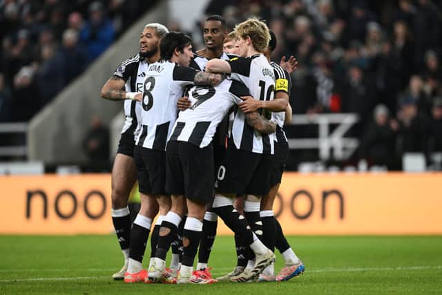 Newcastle players congratulate Alexander Isak (c) after he had scored the second goal during the Premier League match between Newcastle United FC and Wolverhampton Wanderers FC at St James' Park on January 15, 2025 in Newcastle upon Tyne, England. (Photo by Stu Forster/Getty Images)