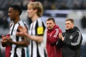 Newcastle United's English head coach Eddie Howe (R) applauds at the end of the English Premier League football match between Newcastle United and Bournemouth at St James' Park in Newcastle-upon-Tyne, north east England on January 18, 2025. Bournemouth wins 4 - 1 against Newcastle United. (Photo by Oli SCARFF / AFP)