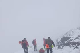 Injured man rescued from snow-covered mountain