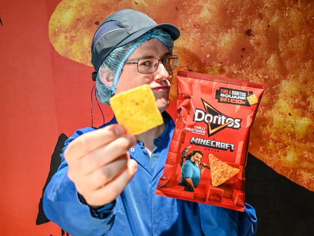 Chief Chip Technician Dan Lynes inspects the world's first square Doritos
