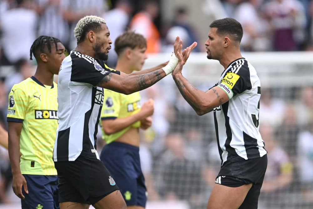 Bruno Guimaraes of Newcastle celebrates with Joelinton after the Premier League match between Newcastle United FC and Southampton FC at St James' Park on August 17, 2024 in Newcastle upon Tyne, England.