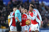 Gabriel of Arsenal and his teammates protest to Referee Michael Oliver after Myles Lewis-Skelly of Arsenal (not pictured) is shown a red card for a foul on Matt Doherty of Wolverhampton Wanderers (not pictured) during the Premier League match between Wolverhampton Wanderers FC and Arsenal FC at Molineux.