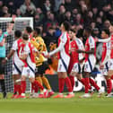 Myles Lewis-Skelly is sent off against Wolves.