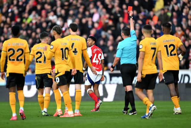 Michael Oliver sending off Myles Lewis-Skelly. 
