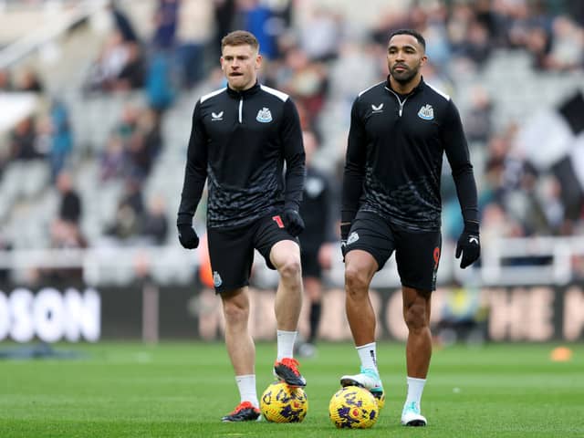 Harvey Barnes and Callum Wilson of Newcastle United look on as the team warms up prior to the Premier League match between Newcastle United and Luton Town at St. James Park on February 03, 2024 in Newcastle upon Tyne, England. (Photo by Matt McNulty/Getty Images)