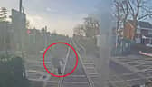 Woman comes within ‘half a second’ of being struck by train at level crossing.