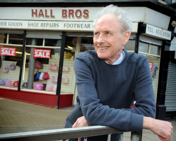 Robert Hall has a last look round outside his Hall Bros shop in 2015.
