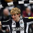 Newcastle United's English midfielder #10 Anthony Gordon celebrates after scoring his team's second goal during the English League Cup semi-final second leg football match between Newcastle United and Arsenal at St James' Park, in Newcastle-upon-Tyne, north east England, on February 5, 2025. (Photo by Paul ELLIS / AFP)    