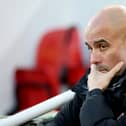 Pep Guardiola, Manager of Manchester City, looks on prior to the Premier League match between Liverpool FC and Manchester City FC at Anfield on December 01, 2024 in Liverpool, England. 