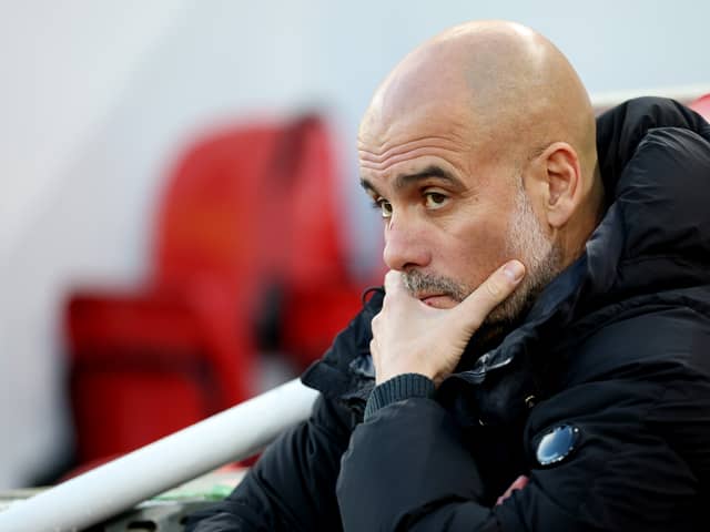 Pep Guardiola, Manager of Manchester City, looks on prior to the Premier League match between Liverpool FC and Manchester City FC at Anfield on December 01, 2024 in Liverpool, England. 