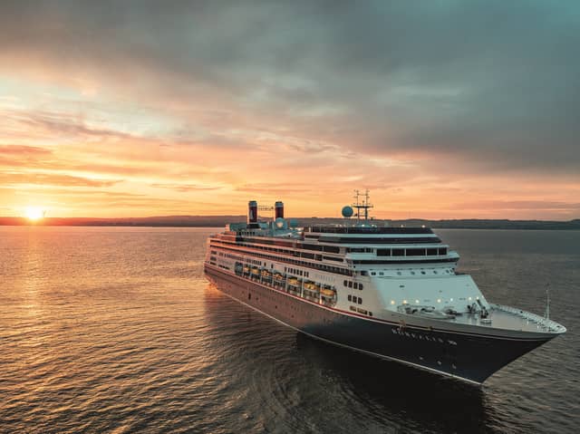 Borealis at sea at sunset