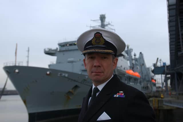 Captain Leslie Coupland OBE was pictured with the ship in 2003.