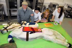 Stacie Stewart (second left) with her Grandad Ernest Fowler  and staff Mandy Scott, and Hannah Warwick-Soden with the cake of racehorse Desert Orchid.