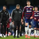 Newcastle United's English head coach Eddie Howe (C) reacts on the pitch after the English Premier League football match between Manchester City and Newcastle United at the Etihad Stadium in Manchester, north west England, on February 15, 2025. Manchester City won the game 4-0. (Photo by Oli SCARFF / AFP)      