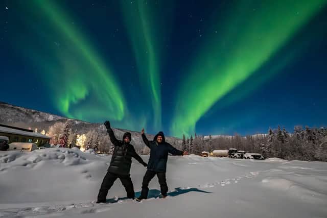 Abbi in front of the Northern Lights in Alaska.