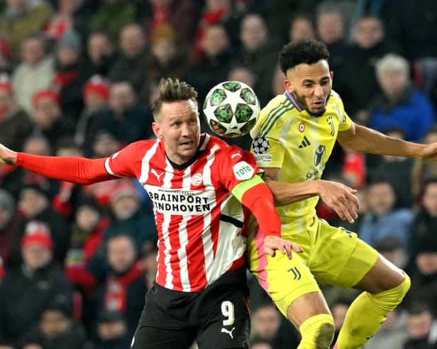 Lloyd Kelly in action for Juventus alongside PSV's Luuk De Jong