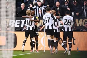 Alexander Isak of Newcastle United celebrates scoring his team's fourth goal with teammate Anthony Gordon during the Premier League match between Newcastle United FC and Nottingham Forest FC at St James' Park on February 23, 2025 in Newcastle upon Tyne, England. (Photo by Stu Forster/Getty Images)