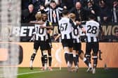 Alexander Isak of Newcastle United celebrates scoring his team's fourth goal with teammate Anthony Gordon during the Premier League match between Newcastle United FC and Nottingham Forest FC at St James' Park on February 23, 2025 in Newcastle upon Tyne, England. (Photo by Stu Forster/Getty Images)