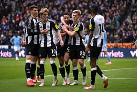 Jacob Murphy of Newcastle United celebrates scoring his team's second goal with teammates during the Premier League match between Newcastle United FC and Nottingham Forest FC at St James' Park on February 23, 2025 in Newcastle upon Tyne, England. (Photo by Stu Forster/Getty Images)
