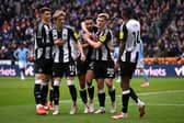 Jacob Murphy of Newcastle United celebrates scoring his team's second goal with teammates during the Premier League match between Newcastle United FC and Nottingham Forest FC at St James' Park on February 23, 2025 in Newcastle upon Tyne, England. (Photo by Stu Forster/Getty Images)