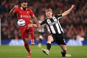 Lewis Hall in action for Newcastle United against Liverpool. 