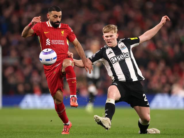 Lewis Hall in action against Mohamed Salah.