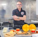 A man who was given a novelty £4.99 cheese making kit as a Christmas present has just built a cheese factory in his back garden after turning it into a business.  