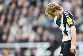 Newcastle United's English midfielder #10 Anthony Gordon leaves the pitch after receiving a red card during the English FA Cup fifth round football match between Newcastle United and Brighton and Hove Albion at St. James' Park in Newcastle-upon-Tyne, north east England on March 2, 2025. (Photo by ANDY BUCHANAN / AFP)