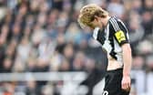 Newcastle United's English midfielder #10 Anthony Gordon leaves the pitch after receiving a red card during the English FA Cup fifth round football match between Newcastle United and Brighton and Hove Albion at St. James' Park in Newcastle-upon-Tyne, north east England on March 2, 2025. (Photo by ANDY BUCHANAN / AFP)