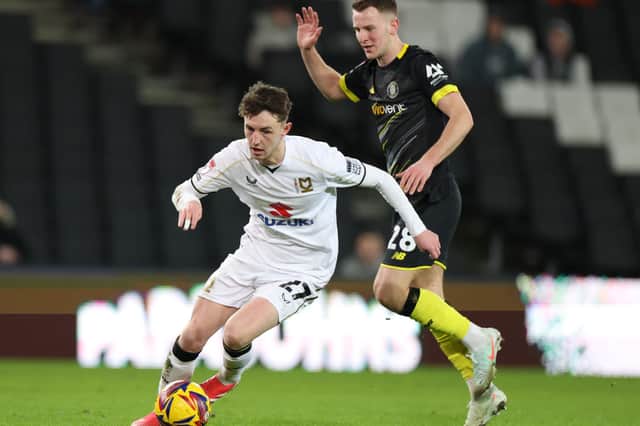 Joe White in action for MK Dons