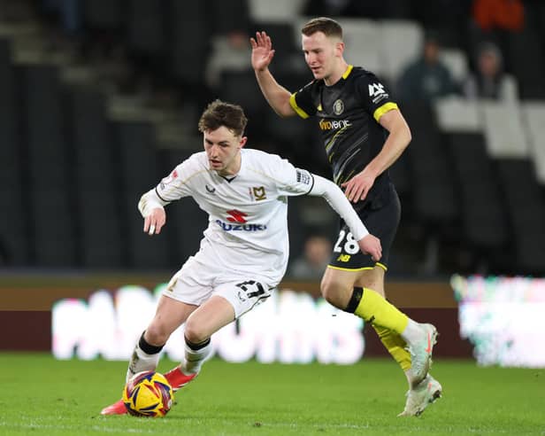 Joe White in action for MK Dons