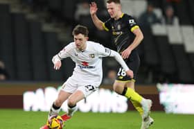 Joe White in action for MK Dons