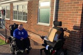 William Calvert, 12, beams with joy after unwrapping his new all-terrain wheelchair. 
