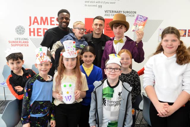 SAFC players Salis Abdul Samed and Enzo Le Fee visit the Beacon of Light for World Book Day.