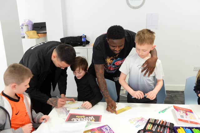 SAFC players Salis Abdul Samed and Enzo Le Fee working with children at the Beacon of Light.