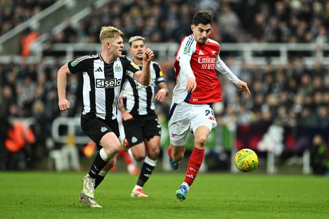 Kai Havertz of Arsenal and Lewis Hall of Newcastle United chase the ball during the Carabao Cup Semi Final Second Leg match between Newcastle United and Arsenal at St James' Park on February 05, 2025 in Newcastle upon Tyne, England.