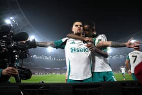 Bruno Guimaraes of Newcastle United celebrates scoring his team's first goal with teammate Alexander Isak during the Premier League match between West Ham United FC and Newcastle United FC at London Stadium on March 10, 2025 in London, England. (Photo by Justin Setterfield/Getty Images)