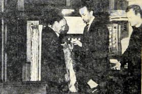 Syd Harrison and the organ which almost disappeared through the church floor.