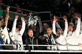 Newcastle United's English head coach Eddie Howe lifts the League Cup trophy after winning the English League Cup final football match between Liverpool and Newcastle United at Wembley Stadium, north-west London on March 16, 2025. Newcastle United wins English League Cup 2 -1 against Liverpool. (Photo by Glyn KIRK / AFP) / RESTRICTED TO EDITORIAL USE. No use with unauthorized audio, video, data, fixture lists, club/league logos or 'live' services. Online in-match use limited to 120 images. An additional 40 images may be used in extra time. No video emulation. Social media in-match use limited to 120 images. An additional 40 images may be used in extra time. No use in betting publications, games or single club/league/player publications. /  (Photo by GLYN KIRK/AFP via Getty Images)          