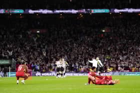 Liverpool's Curtis Jones (right) and Darwin Nunez (left) lay dejected after the Carabao Cup final at Wembley Stadium, London.