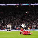 Liverpool's Curtis Jones (right) and Darwin Nunez (left) lay dejected after the Carabao Cup final at Wembley Stadium, London.
