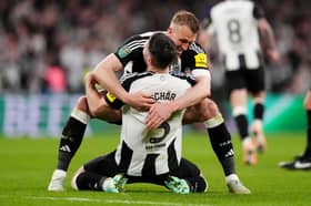 Newcastle United's Dan Burn (right) and Fabian Schar celebrate winning the Carabao Cup final at Wembley Stadium, London.
