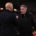 Arne Slot, manger of Liverpool, shakes hands with Jamie Carragher, former Liverpool player and TV pundit prior (Photo by Liverpool FC/Liverpool FC via Getty Images)