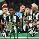 Alexander Isak with the Carabao Cup.