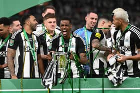 Alexander Isak with the Carabao Cup.