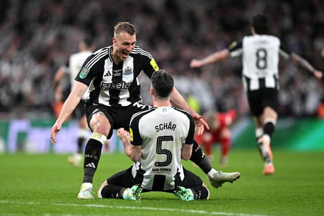 Fabian Schar and Dan Burn celebrate Carabao Cup win.