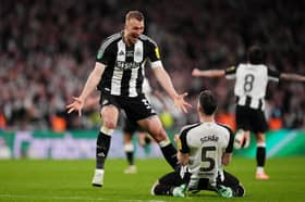 Dan Burn celebrates Newcastle United's Wembley win.